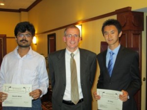 Purdue University MSCE Students and Scholarship Winners Harsh Nisar (left) and Di Chen (right), with SE Solutions, LLC President Brian Quinn
